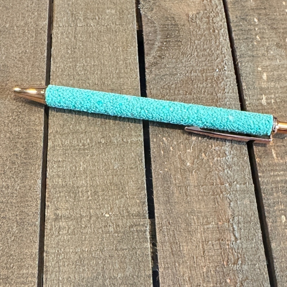Teal glitter pen